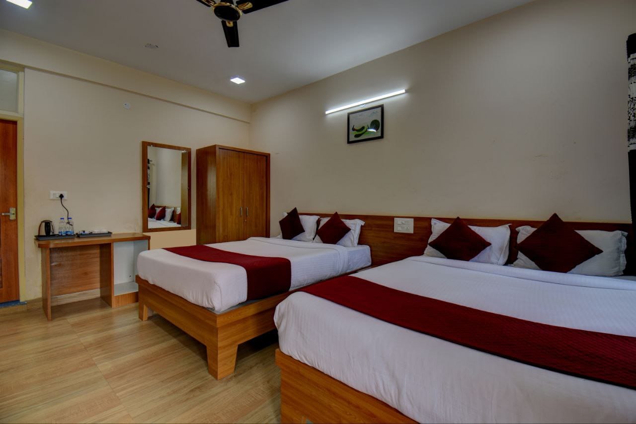 Luxurious twin-bed room layout with sleek vanity mirror and modern amenities